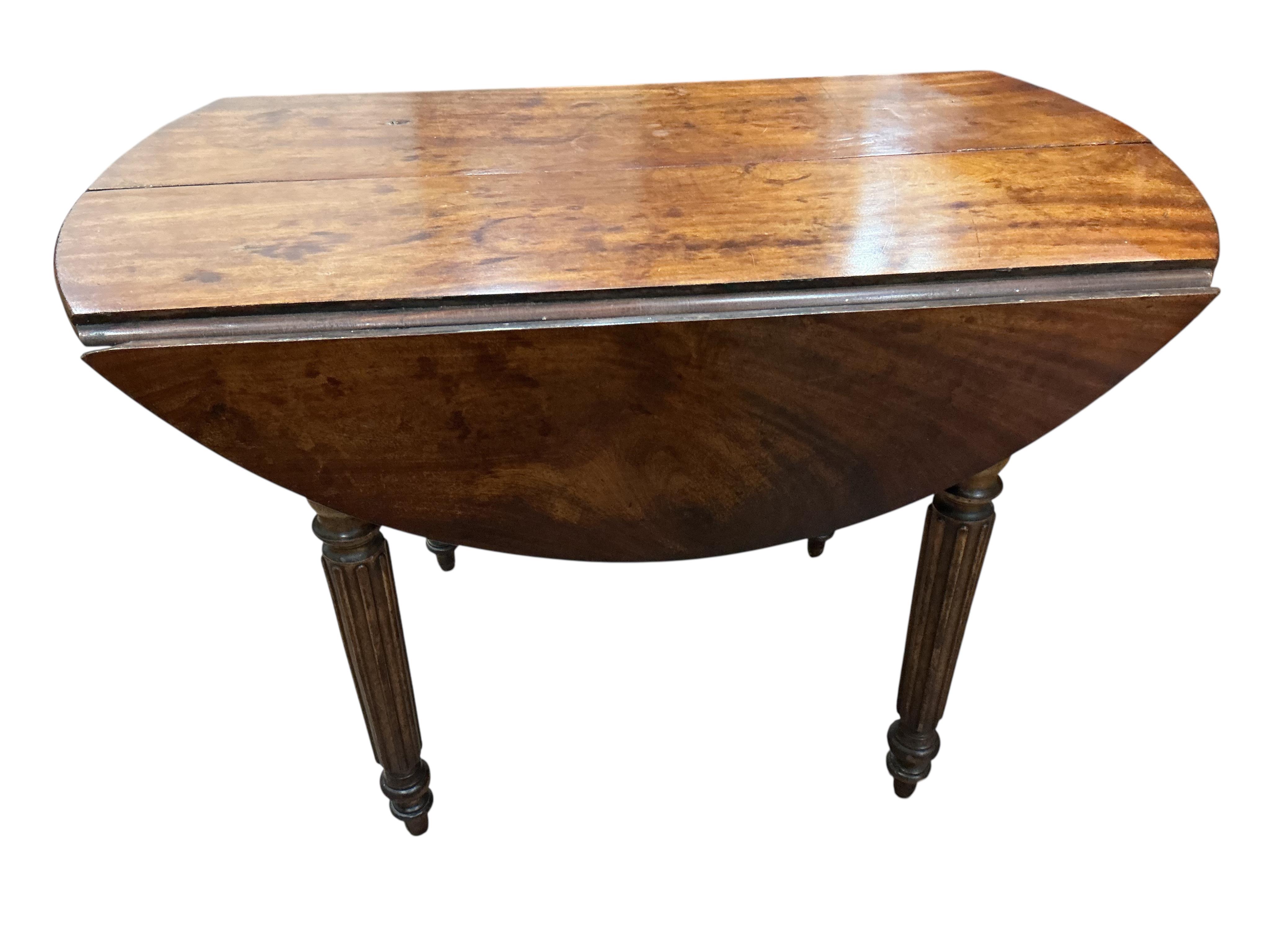 A 19th century French mahogany drop leaf extending dining table, 152cm extended, one spare leaf, depth 96cm, height 66cm